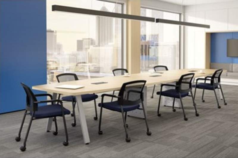 Large, long tan conference table